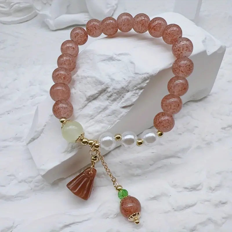 Jordbær kvarz armbånd med lotus sjarm